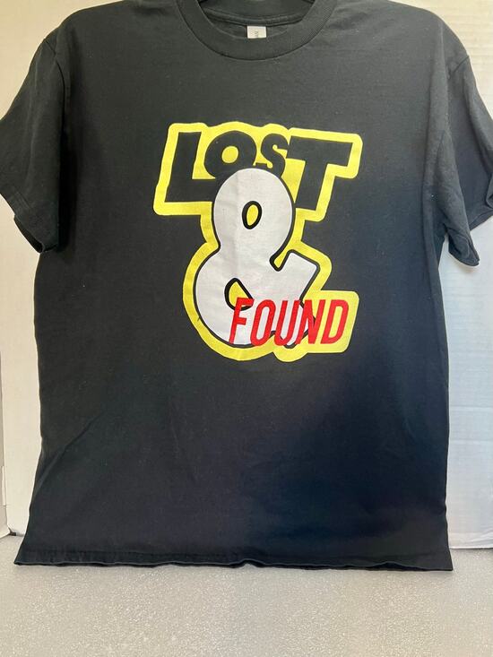 Gildan Tops - Women’s Size Med Gildan T-Shirt.  Black with “Lost & Found” Graphic. B11